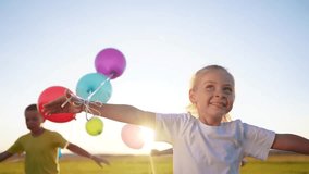 children in balloons in park. children run in nature in park with balloons. happy family kid holiday concept. children view from back silhouette run in nature dream at sunset holding balloons - Powered by Shutterstock - Get 15% off with code: PIKWIZARD15