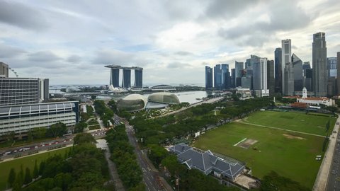 4k UHD beautiful time lapse of cloudscape bright day light at Singapore city skyline. Pan left 