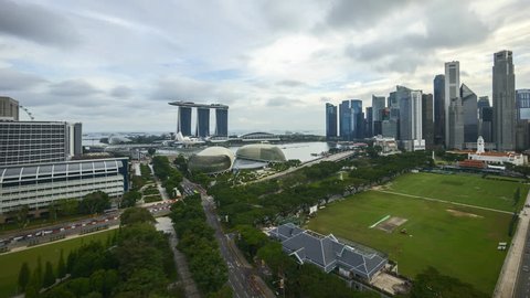 4k UHD beautiful time lapse of cloudscape bright day light at Singapore city skyline. Pan right 