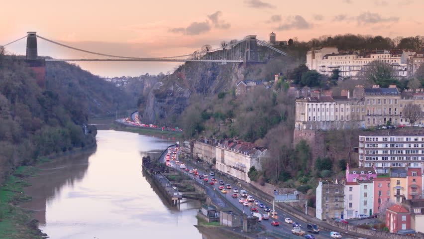 Clifton suspension bridge and colorful hillside houses, Hotwells. Sunset drone Royalty-Free Stock Footage #3458930673