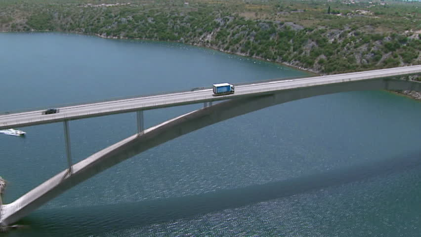 A truck driving across the bridge