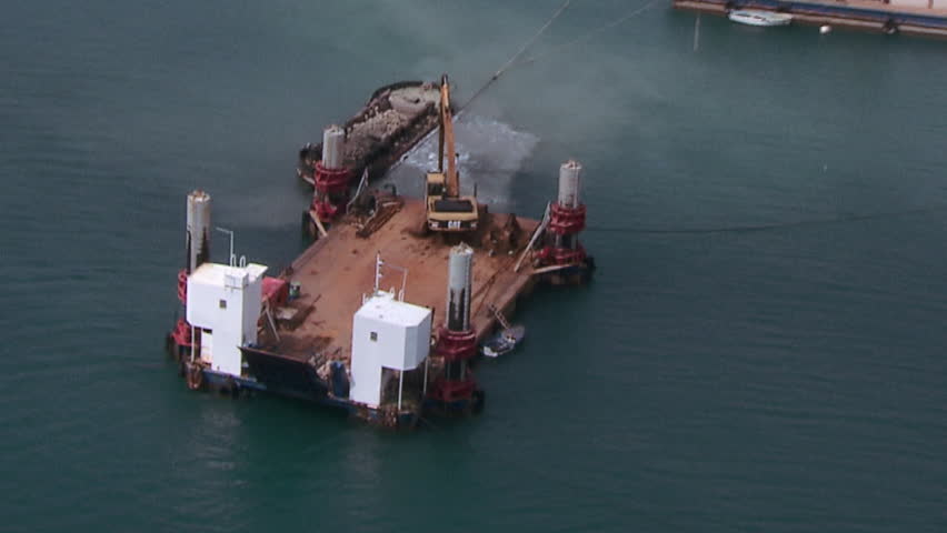 A Cargo port and a dredger in function