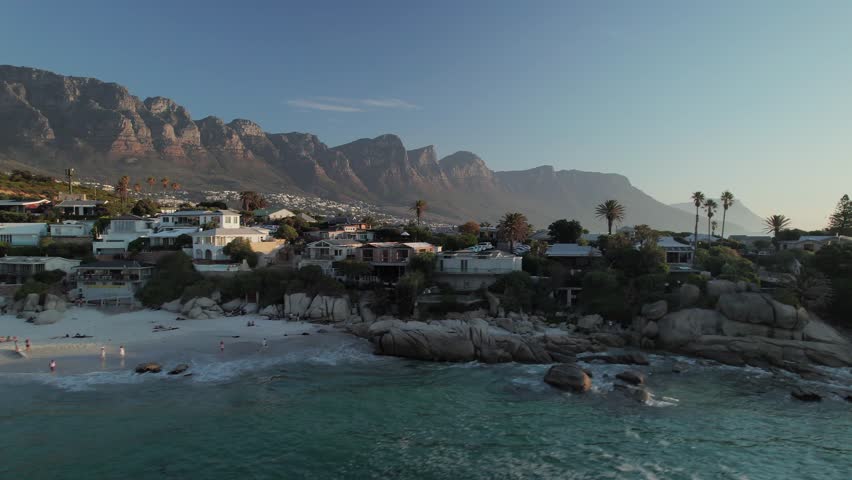 Foggy Twelve Apostles Mountain Seen From Clifton 4th Beach In Cape Town, South Africa. drone ascending shot