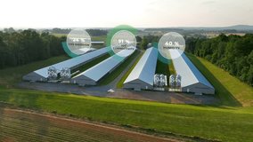 Chicken houses with overlay of data graphics on CO2, humidity, and IoT connectivity. Aerial of futuristic farming in USA with data metrics animations. - Powered by Shutterstock - Get 15% off with code: PIKWIZARD15