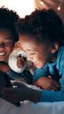 Kids, siblings and tablet in bed, night or happy for movie, funny video or comic meme in house. African children, bedroom or streaming subscription on digital touchscreen, cartoon show or family home