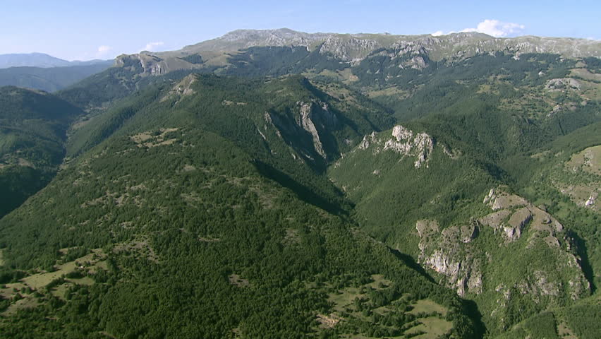 A spectacular aerial of green slopes of Dinaric Alps
