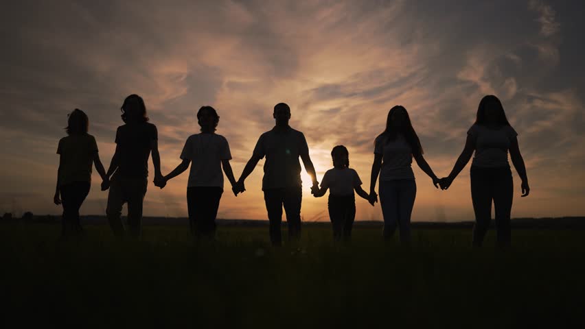 Happy big family. group of people walk together in park at sunset. large family walk together holding hand in park. Family walk together for picnic outdoors in park. Large family team outdoors in park Royalty-Free Stock Footage #3459071293