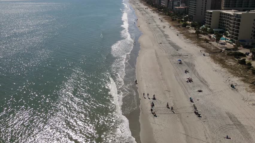 Beach walkers in hyper lapse at Myrtle Beach sc