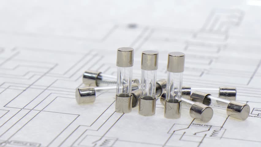 Fuses for overcurrent protection in electronics close-up on an electronic diagram. 