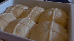 Raw hot cross buns in a baking pan - Powered by Shutterstock - Get 15% off with code: PIKWIZARD15