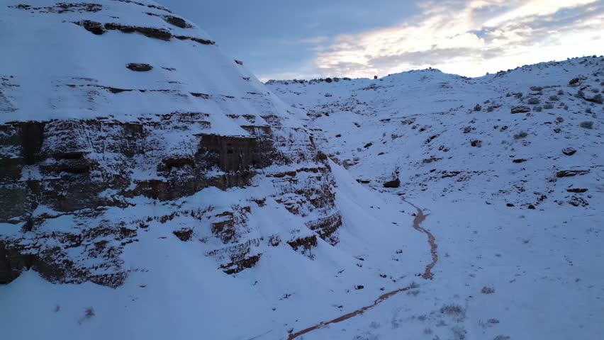 Blue Hour Aerial Colorado Wilderness Snow Morning Sunrise Snowfall Hiking Trail Grand Junction High Desert Winter Wonderland. 4k Drone Pull Back Landscape Nature Cold Environment Ecosystem Background