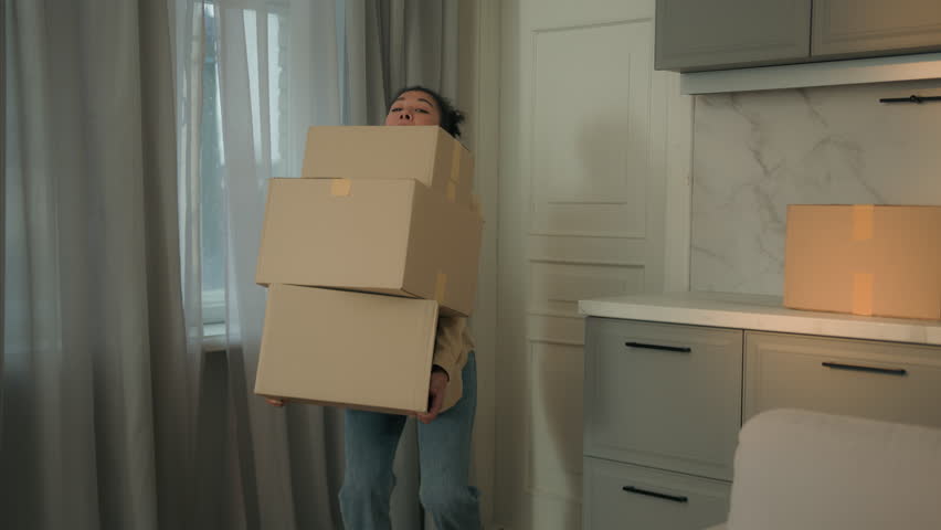 African american woman carrying heavy cardboard boxes delivery moving in new apartment move relocation tired girl carry packages lost balance fall drop parcels crash fail upset displeased lady at home