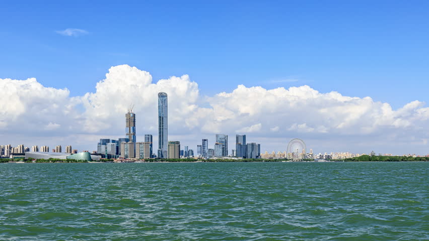 4k Time lapse video, Suzhou skyline and modern city buildings scenery by the lake.
