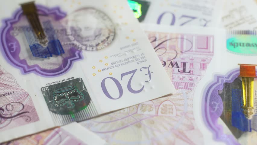 Macro close up British pounds notes details. Watermark. Bank operation, investment. Credit concept. Banknotes english pound, dollar, euro, close up