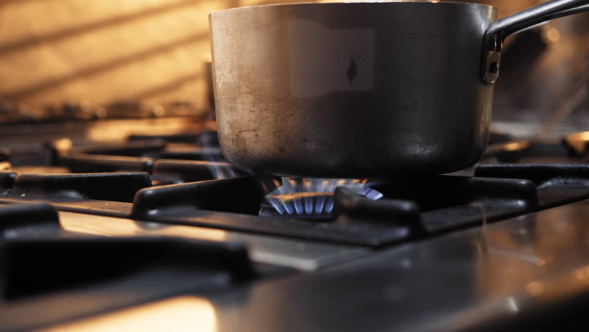 stove and pot releasing the smoke after boiling  Royalty-Free Stock Footage #3459567295