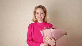 Woman receives bouquet, joyful expression, floral present, peonies and roses - Powered by Shutterstock - Get 15% off with code: PIKWIZARD15