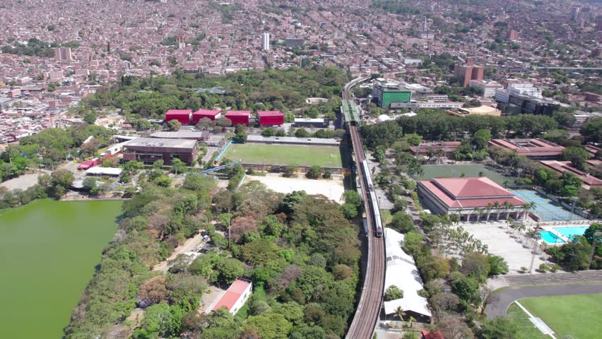 Medellin, Colombia. Aerial View, Parque Explora, Train at Station and University of Antioquia, Drone Shot