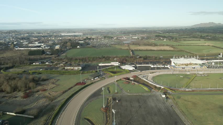 Dundalk Racecourse Stadium On Sunny Day In County Louth, Ireland. aerial sideways shot