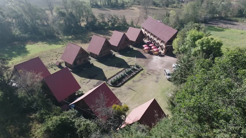 Orbit Shot Of Distinctive Wooden House Cottages In Rural Area, Mexico 