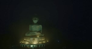 aerial Hyperlapse view around Phuket big Buddha in beautiful twilight..360 degree view on Phuket big Buddha viewpoint..Video clips for travel and religious ideas..smooth cloud in dark sky background