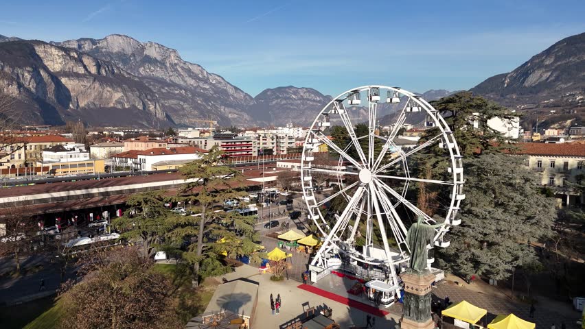 Ferris wheel in the city of Trento in northern Italy. Aerial view.