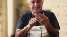 Senior man close-up hand holding cellphone device typing message, 70s male caucasian person engaged with modern technology using smartphone - Powered by Shutterstock - Get 15% off with code: PIKWIZARD15
