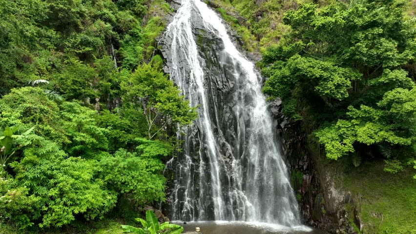 Water flows over rocky terrain creating picturesque natural scenery