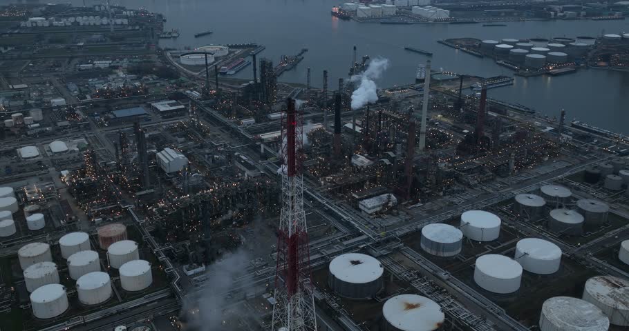 Petrochemical refinery at night in the port of Antwerp, Belgium. Chemical production from crude oil like LPG, petrol, naphtha, kerosene, diesel, gas oil, fuel oil and raw materials for the chemical