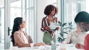 Business people, documents and presentation with team in meeting for collaboration or staff training at office. Woman or coach talking to group of employees with paperwork in boardroom at workplace - Powered by Shutterstock - Get 15% off with code: PIKWIZARD15