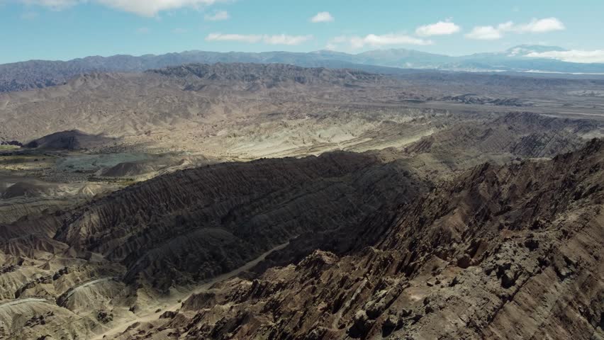 Flyover rugged mountain landscape in high mountains of Argentina