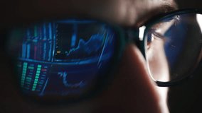 Businessman working on laptop to research cryptocurrency financial markets. Trader or analyst wearing glasses. Analyzing prices stock market to make investment. Finance charts and graphs of crypto - Powered by Shutterstock - Get 15% off with code: PIKWIZARD15