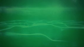 Animation of data processing over waves on green background. Global technology, computing and digital interface concept digitally generated video. - Powered by Shutterstock - Get 15% off with code: PIKWIZARD15