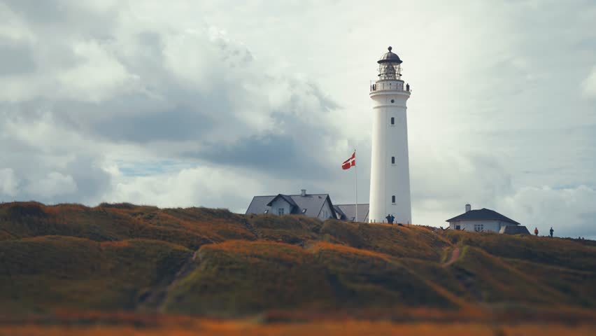 Stormy clouds roll above the lighthouse in Hirtshals on the Danish coast.