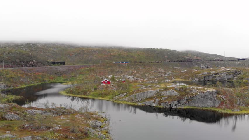 Aerial: ore train in Søsterbekk stasjon, close to the border between Sweden and Norway in north Lapland