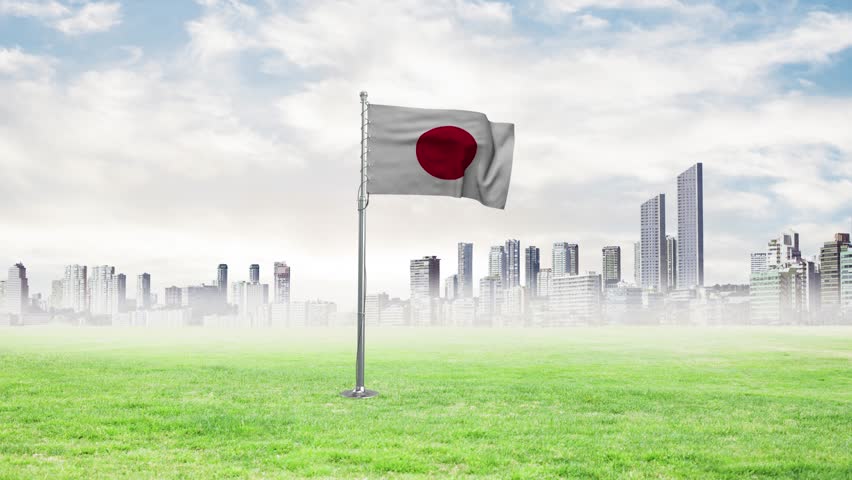 The flag of Japan is flying and the birds are flying with it