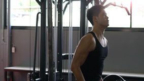 HD slow motion Video : fitness man doing exercises in the gym
