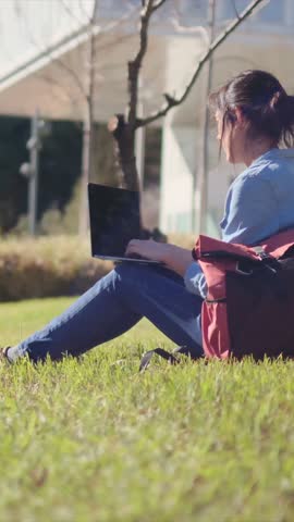 A university student, immersed in studying on campus with her laptop, embraces outdoor tranquility, confident in her e-learning journey.	 Royalty-Free Stock Footage #3460577331