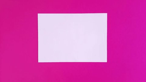Blank sheet of white paper appears on pink background and disappears. Stop motion animation. Video stock