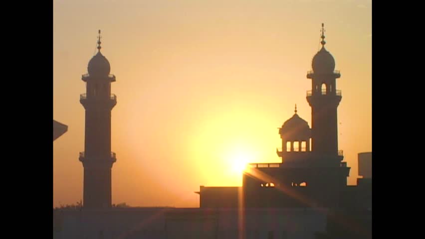 INDIA - 1999 - Close-up of the sun setting behind India's Golden Temple. Royalty-Free Stock Footage #3460597193
