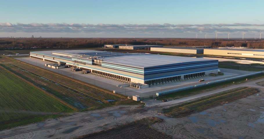 Modern sustainable distribution center used to supply supermarkets. Aerial drone view. The Netherlands. Royalty-Free Stock Footage #3460602461