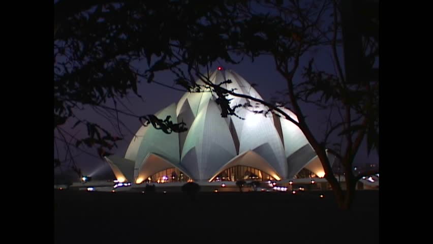 INDIA - 1999 - Exteriors of the Lotus Temple in New Delhi, India seen through the trees at night. Royalty-Free Stock Footage #3460607603