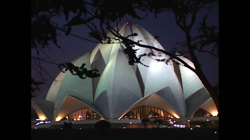 INDIA - 1999 - Exteriors of the Lotus Temple in New Delhi, India seen through the trees at night. Royalty-Free Stock Footage #3460607849
