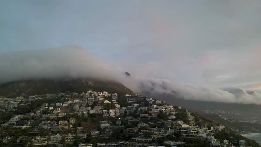 View of morning fog under Table Mountain at sunrise, Cape Town, South Africa.