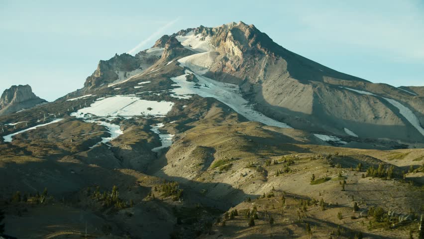 Handheld footage of Mt. Hood near sunset with some snow.