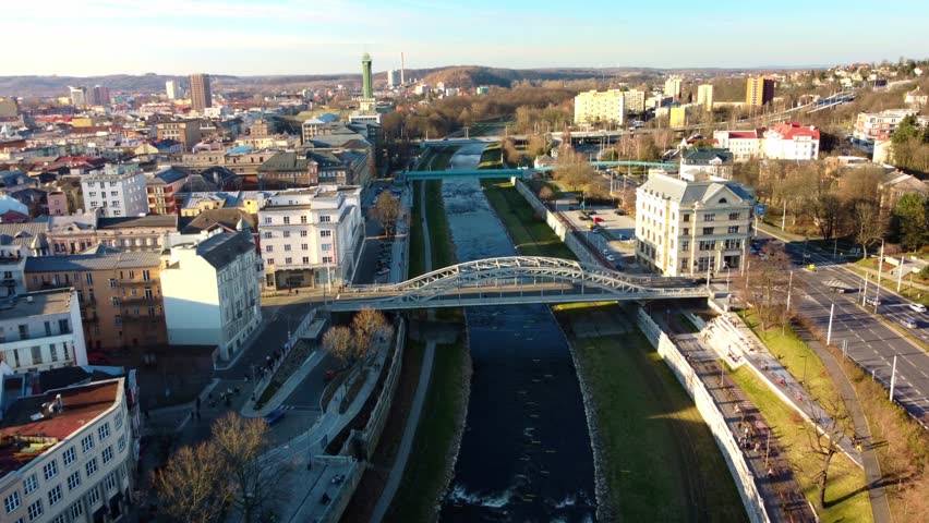 Above View Of Milos Sykora Bridge Over Ostravice River in Ostrava, Czech Republic. Aerial Drone Shot