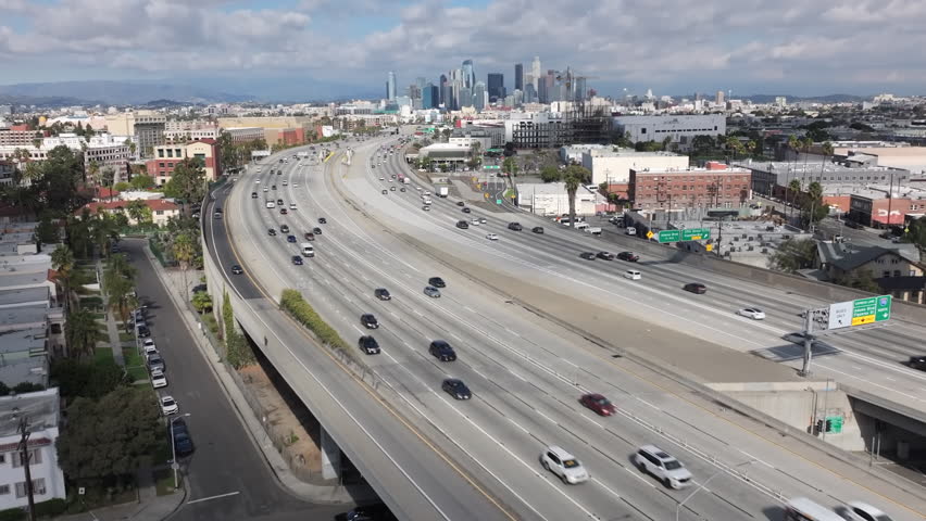 Pasadena 110 Freeway in city of Los Angeles on a cloudy day, aerial of downtown LA