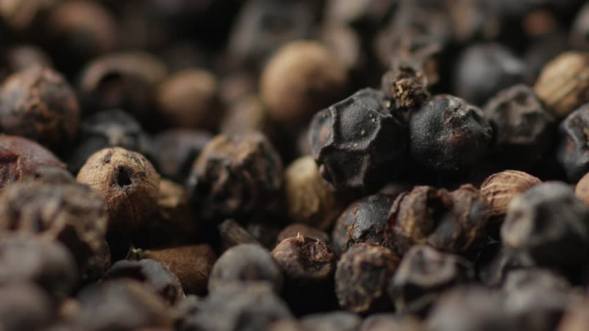 Dried Black Peppercorns Falling, Extreme Close Up Of Pepper Spice Seeds