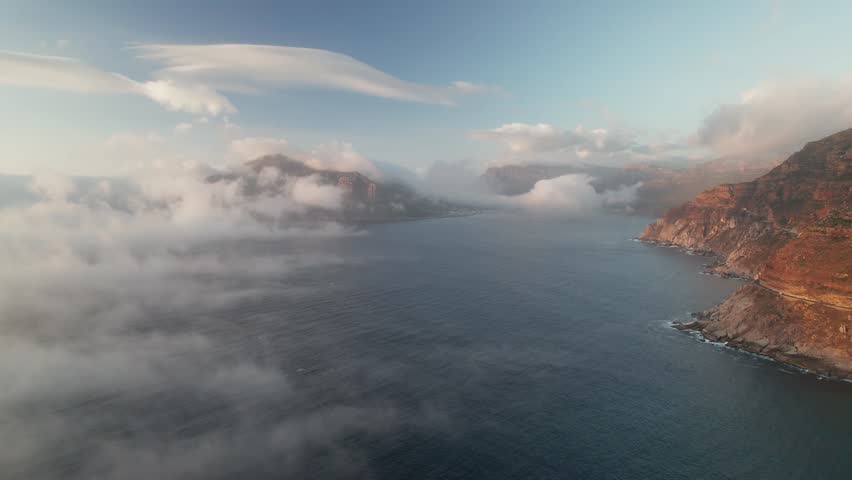 Clouds Over The Sea In The Coast Of Noordhoek During Sunset In Cape Town, South Africa. - aerial shot