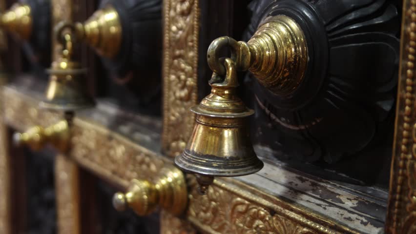 Bells on the door of a hindu temple in the Little India neighborhood of downtown Singapore in Asia