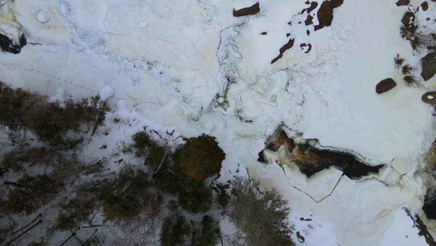 Aeria view high of forest and waerfall covered snowy in the Gooseberry Falls State Park, MN.